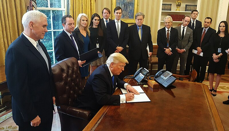 Trump signing executive orders.